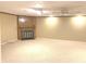 Large basement space with a fireplace and neutral carpet, perfect for a living or recreation room at 1054 Carters Grove, Indianapolis, IN 46260