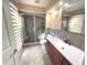 Relaxing bathroom features a glass enclosed shower with a tiled floor and a single sink vanity at 1054 Carters Grove, Indianapolis, IN 46260