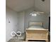 Cozy bedroom featuring vaulted ceilings and a ceiling fan with integrated lighting at 1054 Carters Grove, Indianapolis, IN 46260