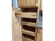 Kitchen pantry cabinet features pull-out shelves for easy storage and accessibility of cookware at 1054 Carters Grove, Indianapolis, IN 46260