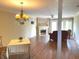 Spacious living room featuring a fireplace, chandelier and hardwood floors at 1054 Carters Grove, Indianapolis, IN 46260