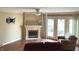 Living room featuring a fireplace and a ceiling fan at 1054 Carters Grove, Indianapolis, IN 46260