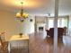 Spacious living room featuring a fireplace, chandelier and hardwood floors at 1054 Carters Grove, Indianapolis, IN 46260