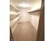 Functional walk-in closet with built-in shelving and hanging space for storage solutions at 1054 Carters Grove, Indianapolis, IN 46260
