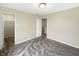 This bedroom features two walk-in closets, a ceiling light, and plush carpeting, creating a functional and stylish space at 10719 Crackling Dr, Indianapolis, IN 46259