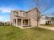 Attractive home featuring a welcoming porch, two-car garage, and landscaped front yard at 10719 Crackling Dr, Indianapolis, IN 46259