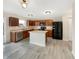 Well-equipped kitchen with an island, stainless steel appliances, and ample counter space at 10719 Crackling Dr, Indianapolis, IN 46259