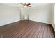 This inviting living room is brightened by natural light and enhanced with modern wood flooring and fresh neutral paint at 10719 Crackling Dr, Indianapolis, IN 46259