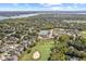 Scenic aerial highlighting community amenities including a golf course and lake views at 10821 Club Point Dr, Fishers, IN 46037
