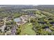Community aerial view featuring golf course, tennis courts, pool, clubhouse and luxurious homes at 10821 Club Point Dr, Fishers, IN 46037