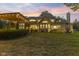 Expansive backyard with lush lawn featuring a charming pergola, perfect for outdoor gatherings and relaxation at 10821 Club Point Dr, Fishers, IN 46037