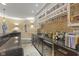 Basement wet bar featuring sleek cabinetry, countertops, and a wine rack, perfect for entertaining guests at 10821 Club Point Dr, Fishers, IN 46037