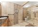 Luxurious bathroom featuring decorative tile accents, glass shower, and granite countertops at 10821 Club Point Dr, Fishers, IN 46037