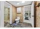 A tiled bathroom with a stand-up shower, leading to a work-out room at 10821 Club Point Dr, Fishers, IN 46037
