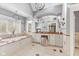 Elegant bathroom featuring a soaking tub, vanity with ample counter space, and decorative lighting at 10821 Club Point Dr, Fishers, IN 46037