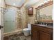 A bathroom featuring tile mosaic walls and flooring and a stand-up shower at 10821 Club Point Dr, Fishers, IN 46037