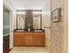 Beautiful bathroom featuring a double sink vanity with granite countertops and modern lighting at 10821 Club Point Dr, Fishers, IN 46037