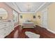 Cozy bedroom with hardwood floors, natural light, and stylish decorations throughout the room at 10821 Club Point Dr, Fishers, IN 46037
