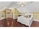 Bright bedroom showcases wood floors, a bed, and an attached room with built-in shelves at 10821 Club Point Dr, Fishers, IN 46037