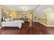 Bedroom featuring hardwood floors, a comfortable sofa, and light, neutral-colored walls at 10821 Club Point Dr, Fishers, IN 46037