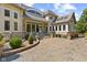 Elegant exterior boasts a grand entrance with steps, a circular driveway, and refined landscaping at 10821 Club Point Dr, Fishers, IN 46037