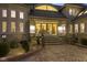 Elegant home entrance with stone accents, landscaping, and a paved driveway leading to a luxurious interior at 10821 Club Point Dr, Fishers, IN 46037