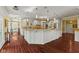 Spacious kitchen with a large island, hardwood floors, and modern lighting fixtures at 10821 Club Point Dr, Fishers, IN 46037