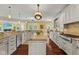 Well-appointed kitchen with an island, custom cabinets, modern appliances, and plenty of counter space for cooking at 10821 Club Point Dr, Fishers, IN 46037