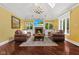 Bright living room with a fireplace, skylight, and comfortable seating at 10821 Club Point Dr, Fishers, IN 46037