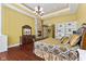 Inviting main bedroom with hardwood floors, fireplace, and a decorative chandelier at 10821 Club Point Dr, Fishers, IN 46037