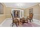 A cozy sitting room with a decorative rug, elegant furnishings, and access to the basement at 10821 Club Point Dr, Fishers, IN 46037