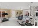 A bright work out room featuring carpet flooring and access to the sauna room at 10821 Club Point Dr, Fishers, IN 46037