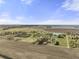 Expansive aerial view of farmland property featuring a house and pond on a sunny day at 11686 S 825 W, Edinburgh, IN 46124