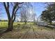 Expansive backyard with mature trees, shed, fencing, and ample space at 11686 S 825 W, Edinburgh, IN 46124