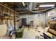 Exposed beam basement area with shelving, exposed pipes, and concrete floors at 11686 S 825 W, Edinburgh, IN 46124