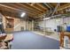 Spacious basement with blue carpeting, a ping pong table, and exposed duct work along the ceiling at 11686 S 825 W, Edinburgh, IN 46124