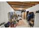 Unfinished basement area with exposed ceiling joists and white brick walls used for storage at 11686 S 825 W, Edinburgh, IN 46124