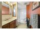 Bathroom featuring a bathtub, single sink vanity, and patterned tile flooring at 11686 S 825 W, Edinburgh, IN 46124