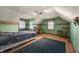 Cozy bedroom with hardwood floors, complemented by green walls and natural light from two well-placed windows at 11686 S 825 W, Edinburgh, IN 46124