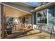 Relaxing covered patio with rocking chairs and outdoor seating. Perfect for enjoying the outdoors at 11686 S 825 W, Edinburgh, IN 46124