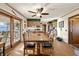 Dining room with a wooden table, multiple chairs and access to an outdoor seating area at 11686 S 825 W, Edinburgh, IN 46124