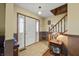 Bright foyer featuring tile floors, a staircase, and a stained glass door at 11686 S 825 W, Edinburgh, IN 46124