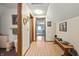 Upstairs hallway with wooden floors, with doors leading to multiple bedrooms and bathrooms at 11686 S 825 W, Edinburgh, IN 46124