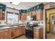 Oak kitchen cabinets with modern appliances and window with a view of the backyard at 11686 S 825 W, Edinburgh, IN 46124
