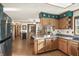Open kitchen and dining room layout featuring oak cabinets and a view to the backyard at 11686 S 825 W, Edinburgh, IN 46124