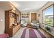 Cozy living room featuring comfortable seating, a large window, and built-in shelving at 11686 S 825 W, Edinburgh, IN 46124