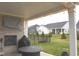 Covered patio with a brick fireplace, outdoor seating, fire pit, and backyard view at 1274 Clairet, Westfield, IN 46074