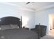 Cozy bedroom with a dark wood bed frame, neutral walls, carpeting, and a comfortable chair at 1274 Clairet, Westfield, IN 46074