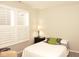 Cozy bedroom with a soft bed, a bedside table, and natural light from the windows at 1274 Clairet, Westfield, IN 46074