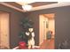 Inviting entryway with dark accent walls, a decorative polar bear, and hardwood flooring at 1274 Clairet, Westfield, IN 46074